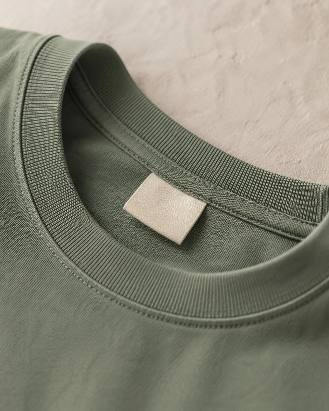 Close-up of the Heritage Canoe Tee collar label and neckline