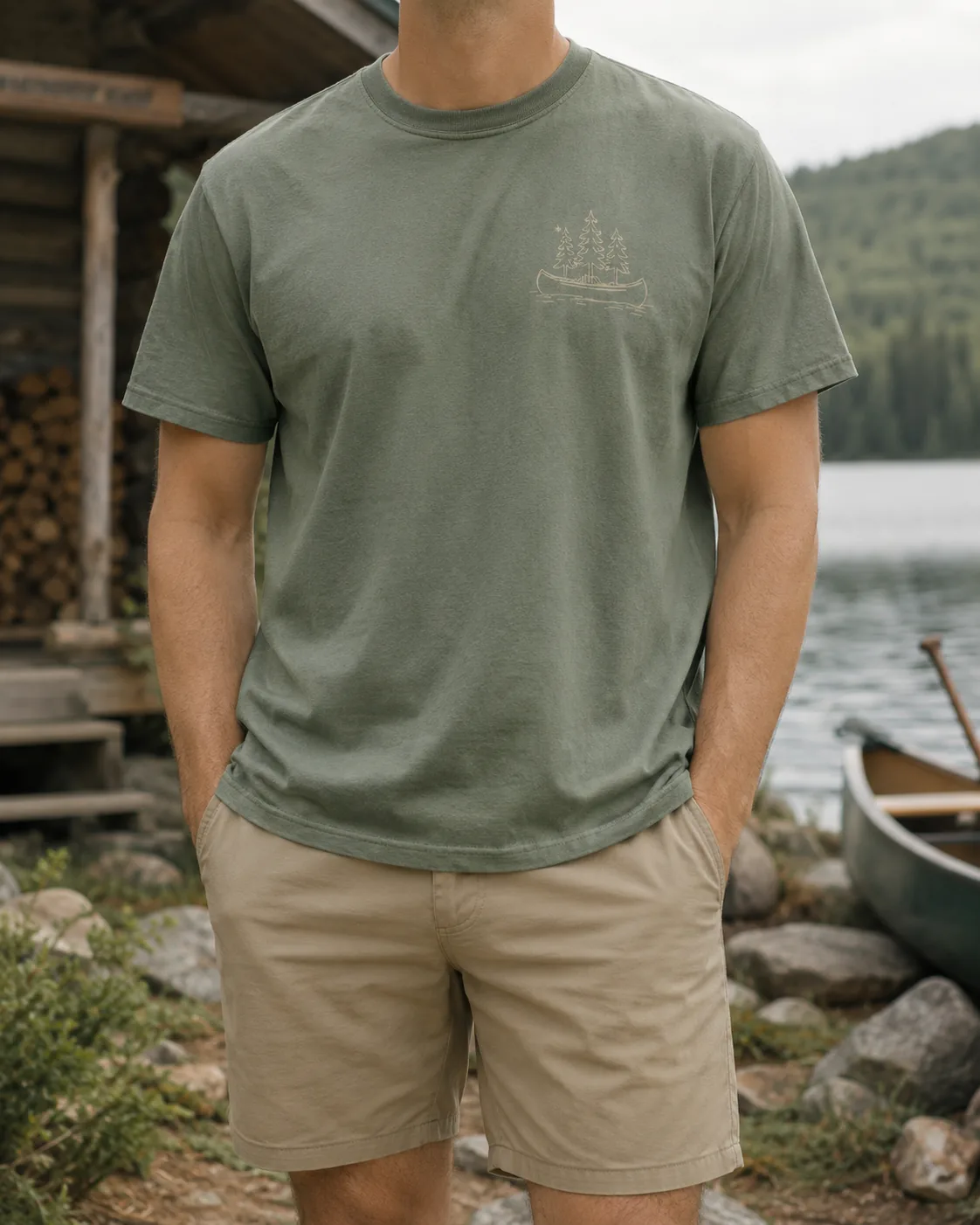 Anonymous model wearing the sage green Heritage Canoe Tee outdoors